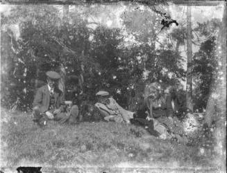 Two Men and Two Women Seated in Woodland