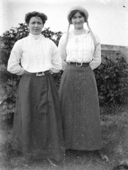 Two Woman Standing Outdoors
