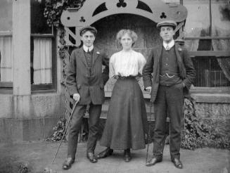 Woman and Two Men at Garden Seat