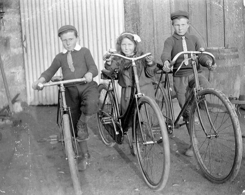 Three Children with Bicycles