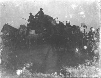 Two Horse Drawn Vehicles on Road