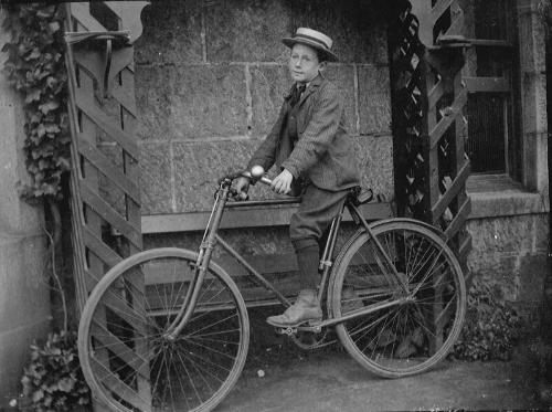 Boy Seated on Bicycle