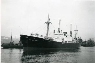 Photograph of cargo vessel 'Whitby Abbey' with steam trawler 'H E Stroud' passing behind