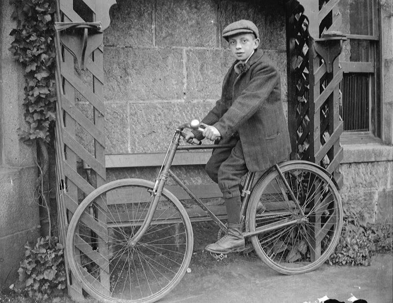 Boy Seated on Bicycle