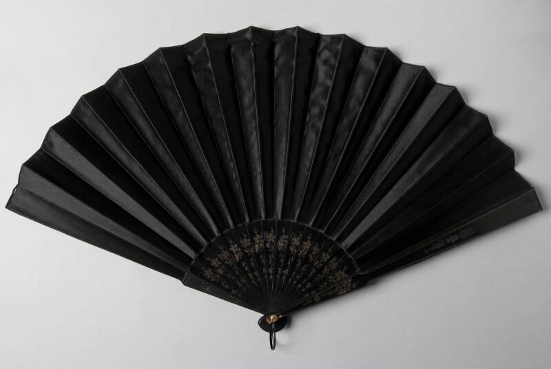 Black Fan With Wood Sticks