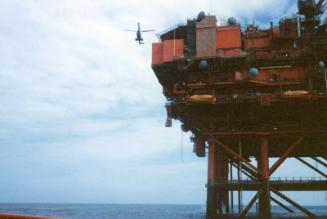 Colour photograph of Murchison Platform with helicopter approaching to land