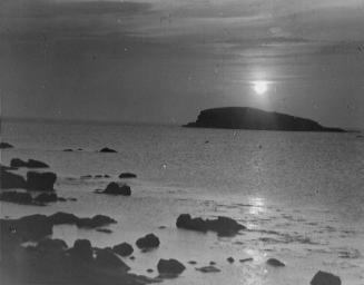 glass lantern slide showing sunset over Unst