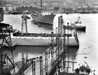 Black and white photograph showing launching of the Discovery