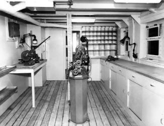 Black and white photograph showing interior of  the Discovery