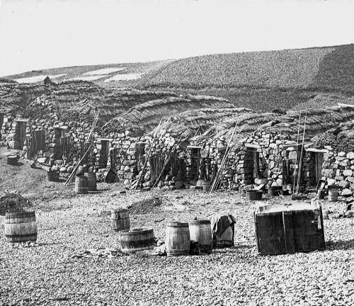 glass lantern slide showing fishermen's huts, Steness (GWW)