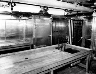 Black and white photograph showing interior of  the Discovery