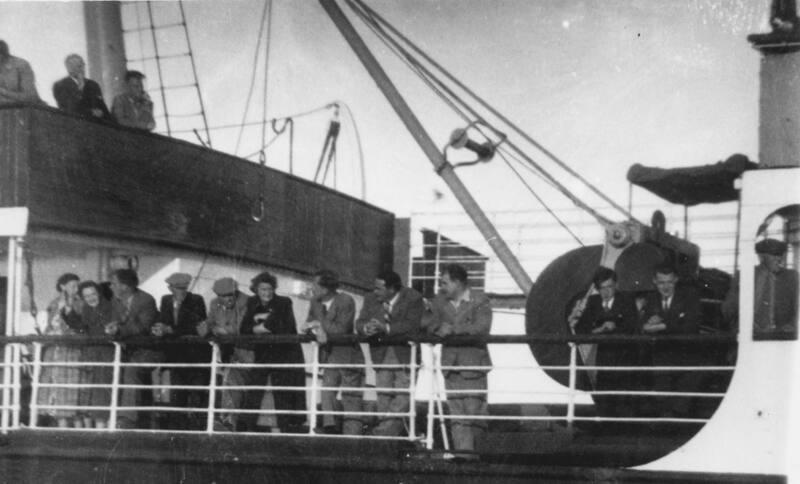 Black and white photograph showing passengers on board St Magnus (III) leaving lerwick, July 1953