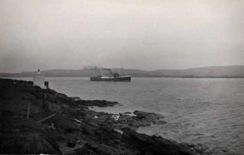 Black and white photograph showing starboard side of St Magnus (III) leaving lerwick, 31 July 1960