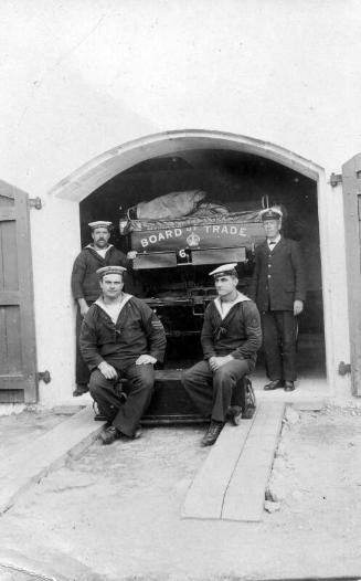 Four members of the Coastguard in from of Board of Trade Carriage