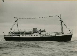 St Ola (II) under way dressed over all