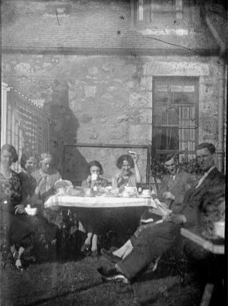 Group at Tea-table Outdoors