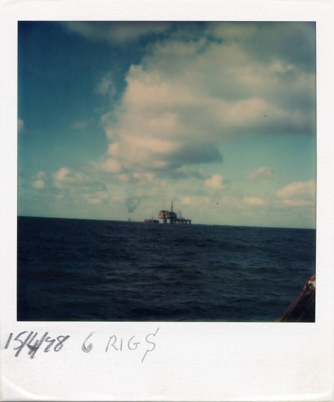 Colour Photograph Showing Six Oil Rigs/Platforms In The North Sea