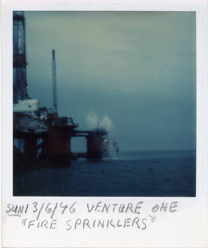Colour Photograph Showing The Drilling Rig 'Venture One' With Fire Sprinklers Going
