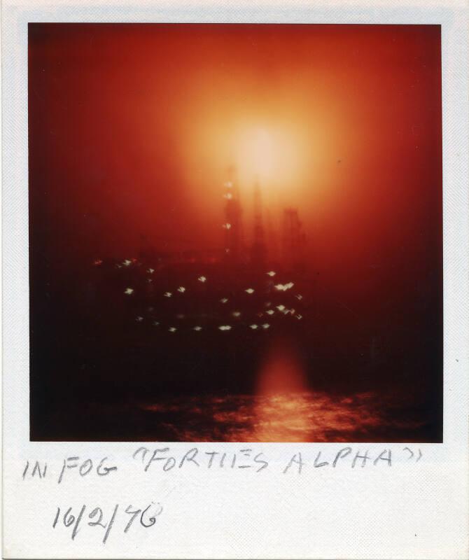 Colour Photograph Showing The Forties Alpha Oil Platform In Fog in The North Sea