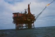 Colour photograph of Murchison Platform with boom flaring