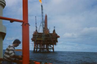 Colour photograph of Murchison Platform with boom flaring