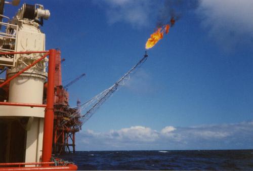 Colour photograph of Murchison Platform with Boom Flaring