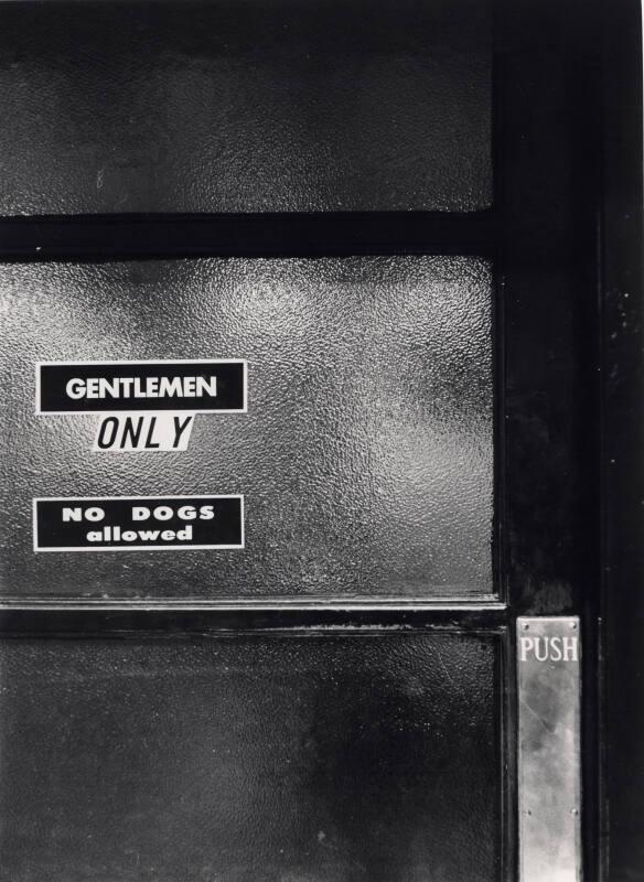 A Door with Several Signs On, Black & White Photograph by Fay Godwin
