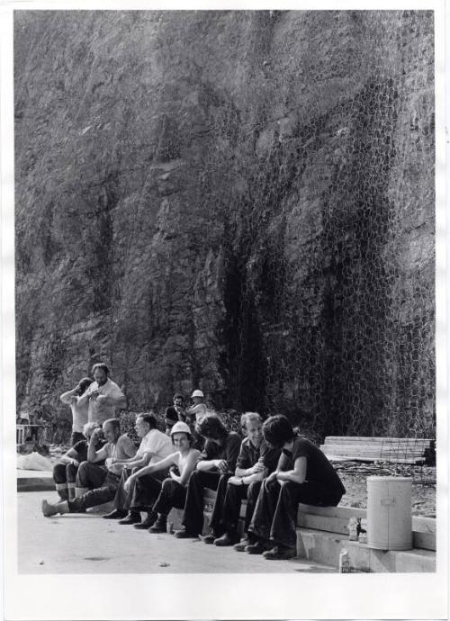 Eleven Men Sat In Front of Netting Black & White Photograph by Fay Godwin