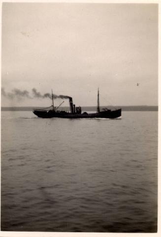 Photograph of a steam trawler under way