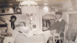 James McBey and Unknown Woman in Dining Room (Photograph Album Belonging to James McBey)