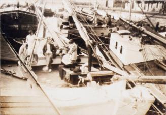 Family on a Boat (Photograph Album Belonging to James McBey)