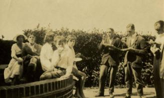 Group photograph of people eating outside (Photographs of People in James McBey's Life)