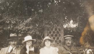 Four Figures Sitting Outdoors (Photograph Album Belonging to James McBey)