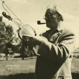James McBey with violin (Photographs of James McBey)