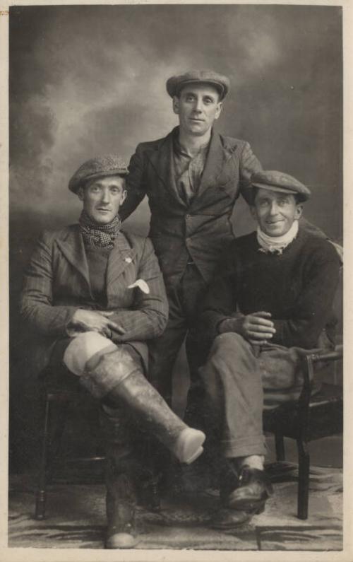 black/white photograph showing Mr F W Olley, trawlerman, and two other trawlermen