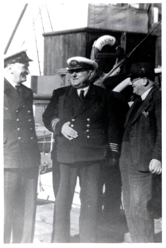 photograph taken aboard 'St Ola' (I) at Stromness showing captain and harbour officials