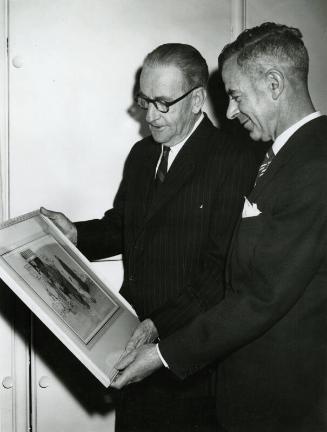 Photograph of Two Unknown Men Looking at a James McBey Watercolour (Memorabilia after 1959 Related to James McBey)