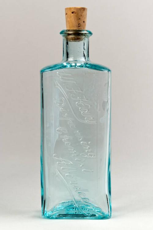 Blue-Tinted Glass Squared Embossed Mixture Bottle