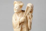 Japanese Carved Okimono Figure of a Man with a Fan