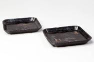 Pair of Chinese Black Lac Burgauté Dishes with Garden Scenes