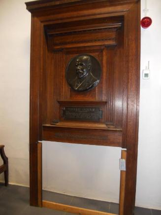 Commemorative fire-surround with plaque