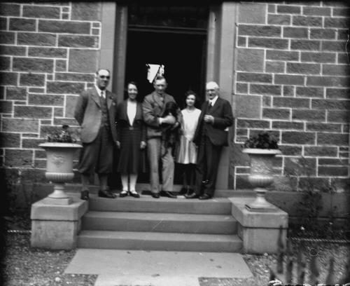 Group at Doorstep of Hotel 