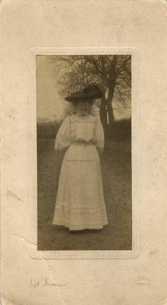 Photograph of  Woman in Summer Dress with Large Hat