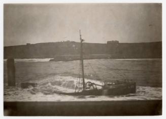 Black and white photograph Showing A Steam Trawler Wrecked At The North Pier