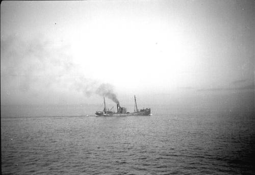 film negative showing an unidentified trawler in silhouette