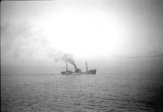film negative showing an unidentified trawler in silhouette
