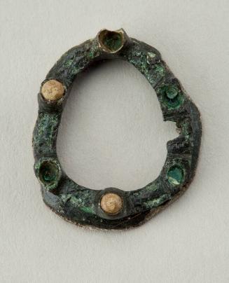 E38 Oval copper alloy brooch with six collets from Carmelite friary