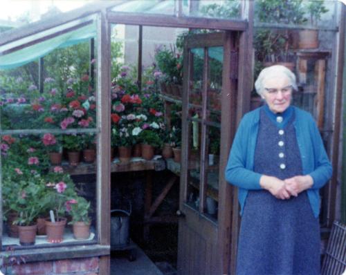 Miss Marget Husband By Her Greenhouse, with Pelargoniums, Ceres