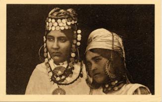 Two women in ethnic headdress 