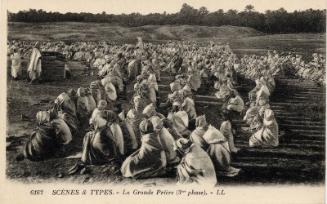 Outside scene of large group of kneeling men (Le Grande Priere) 